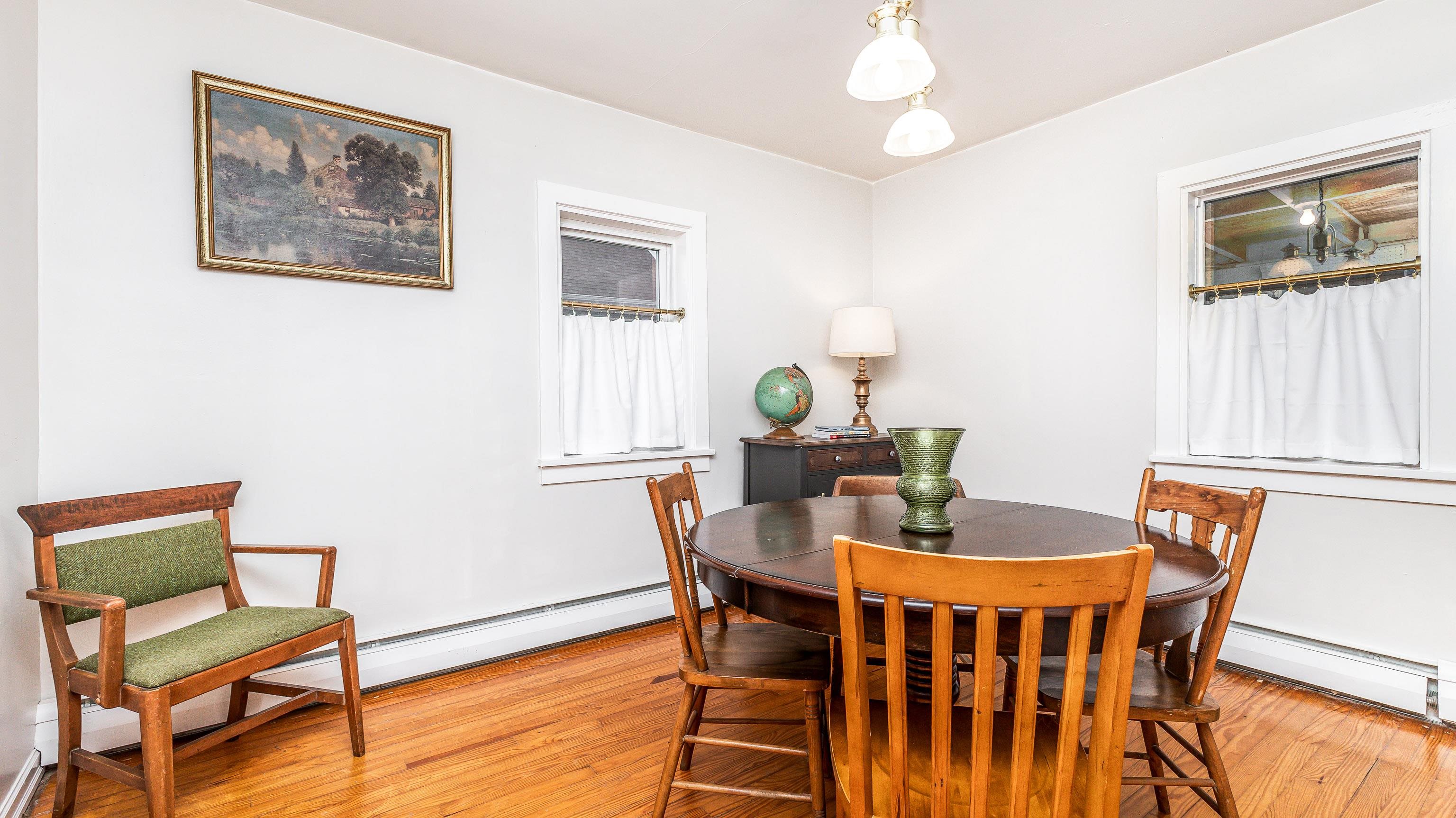 803 Ridge Street Galena, IL 61036 - Photo 18 of 40 a view of a dining room with furniture window and wooden floor