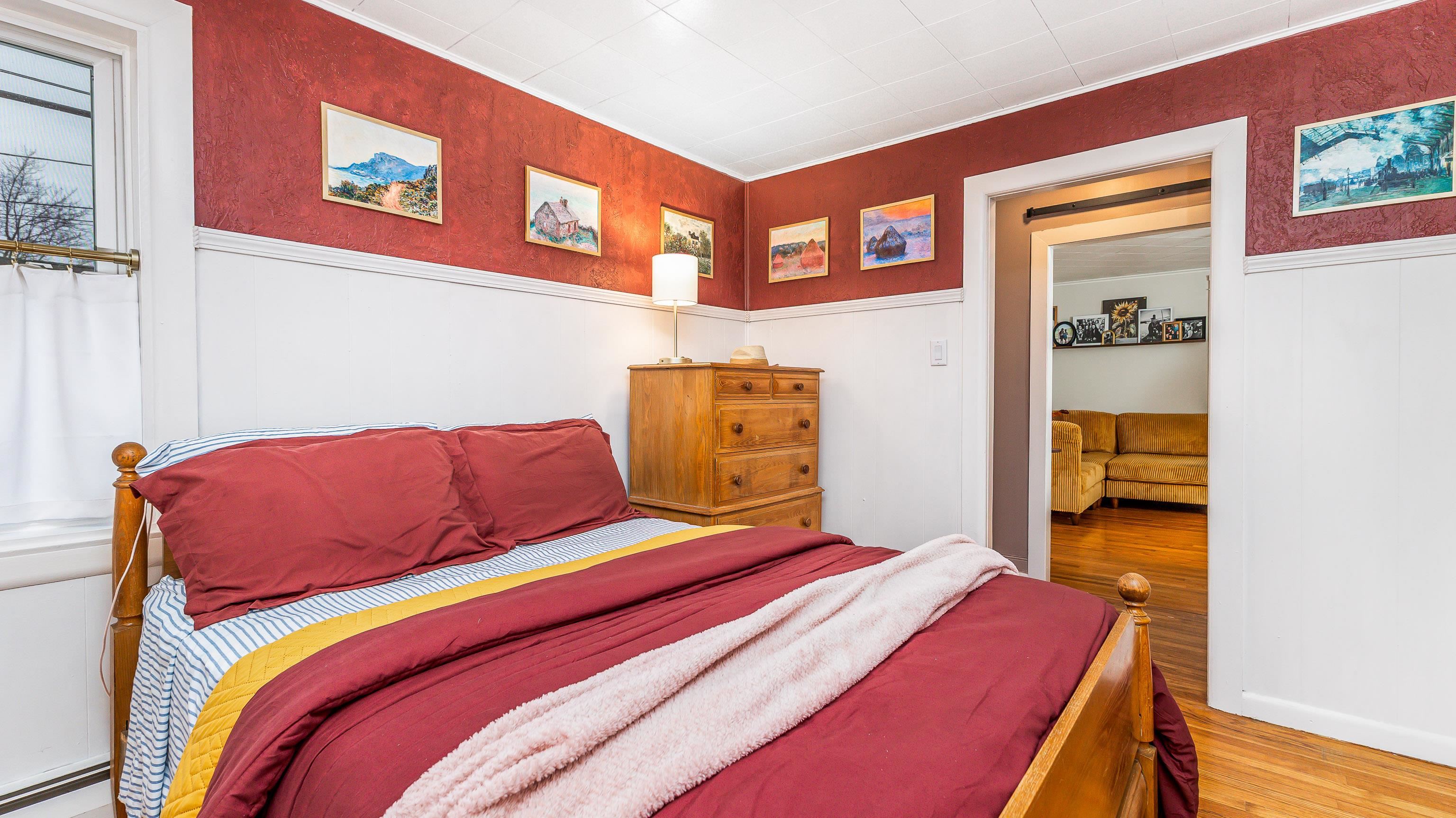 803 Ridge Street Galena, IL 61036 - Photo 19 of 40 a bedroom with a bed and a lamp on dresser