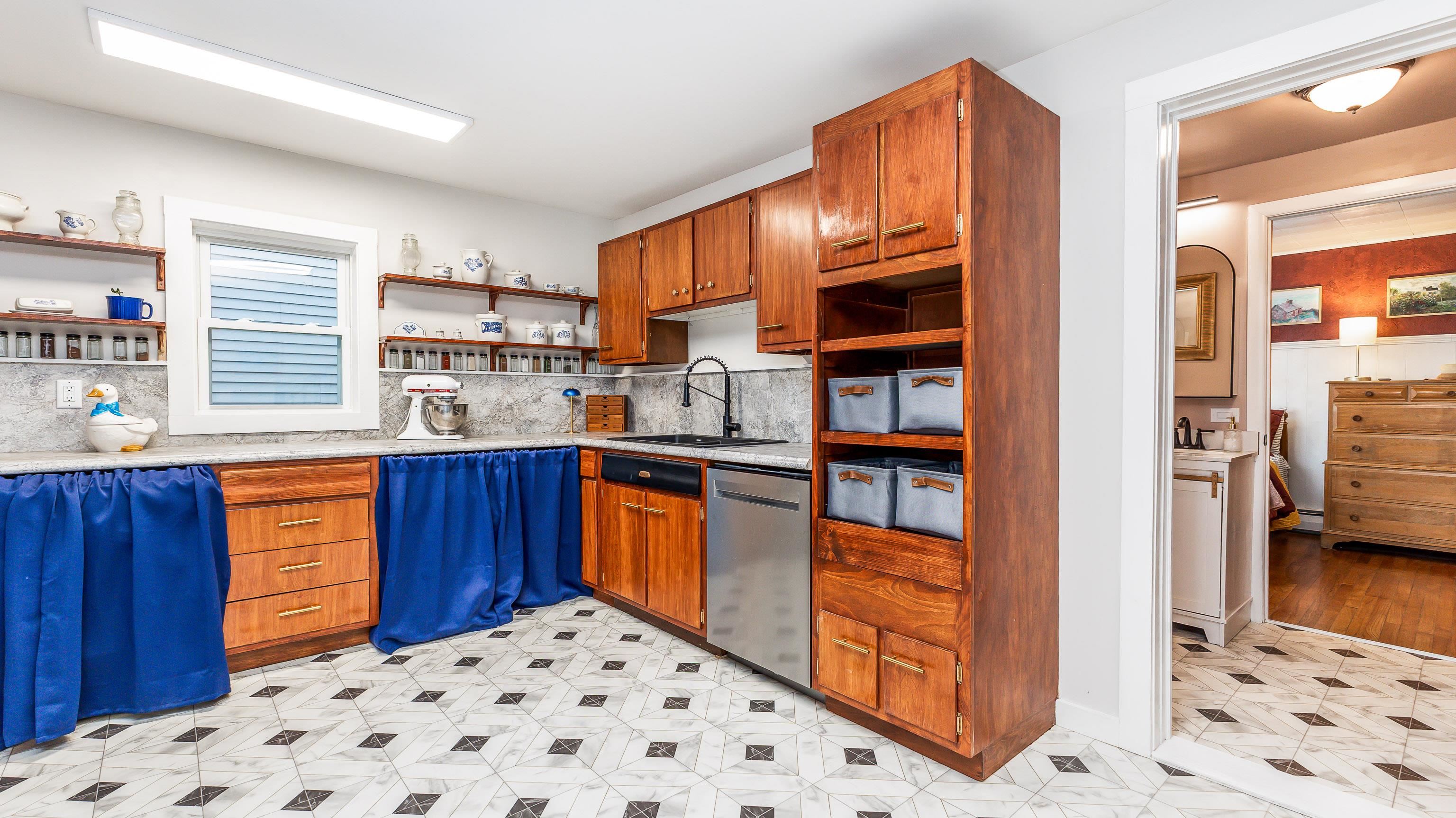 803 Ridge Street Galena, IL 61036 - Photo 22 of 40 a kitchen with stainless steel appliances kitchen island granite countertop a refrigerator and a wooden cabinets