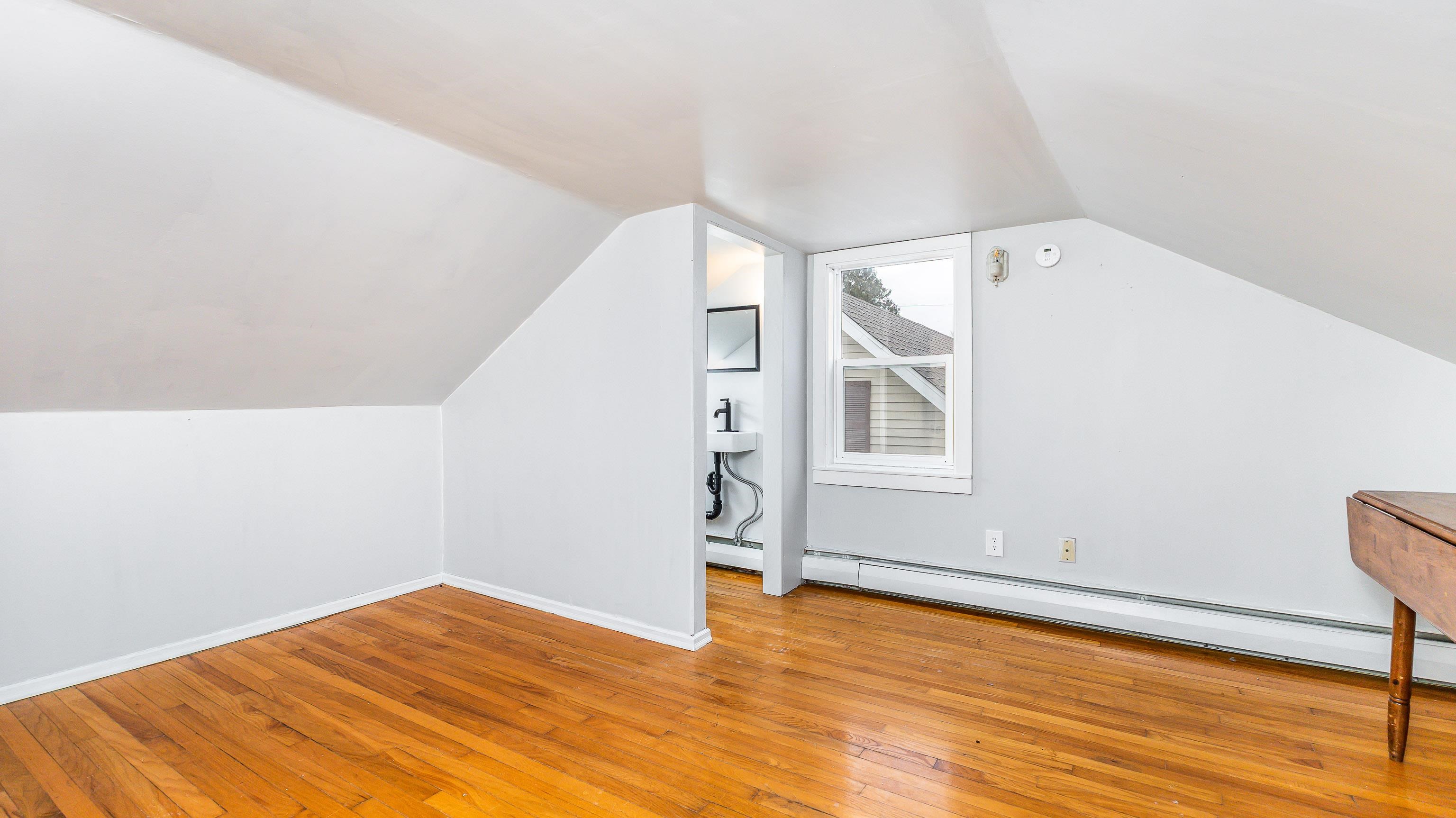 803 Ridge Street Galena, IL 61036 - Photo 24 of 40 a view of empty room with wooden floor and fan
