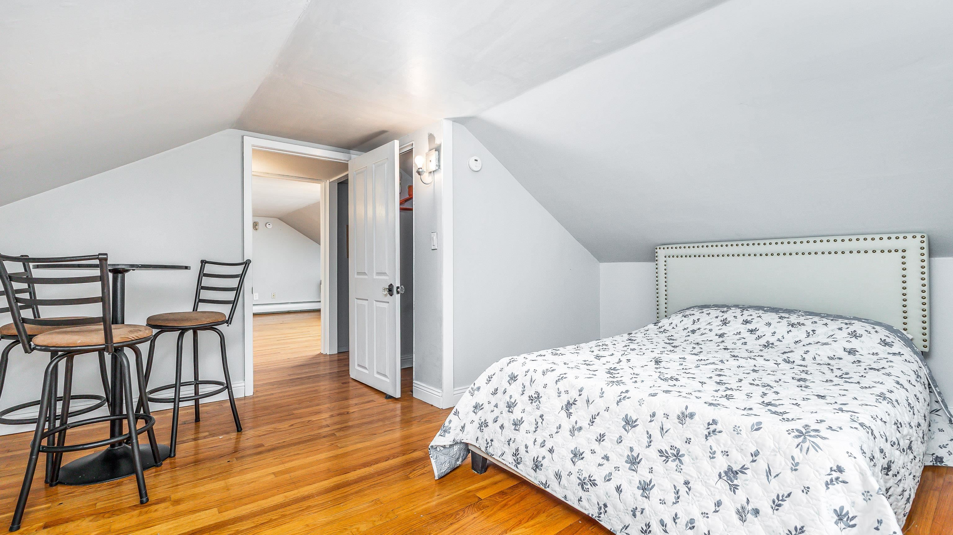 803 Ridge Street Galena, IL 61036 - Photo 30 of 40 a bedroom with a bed and a table