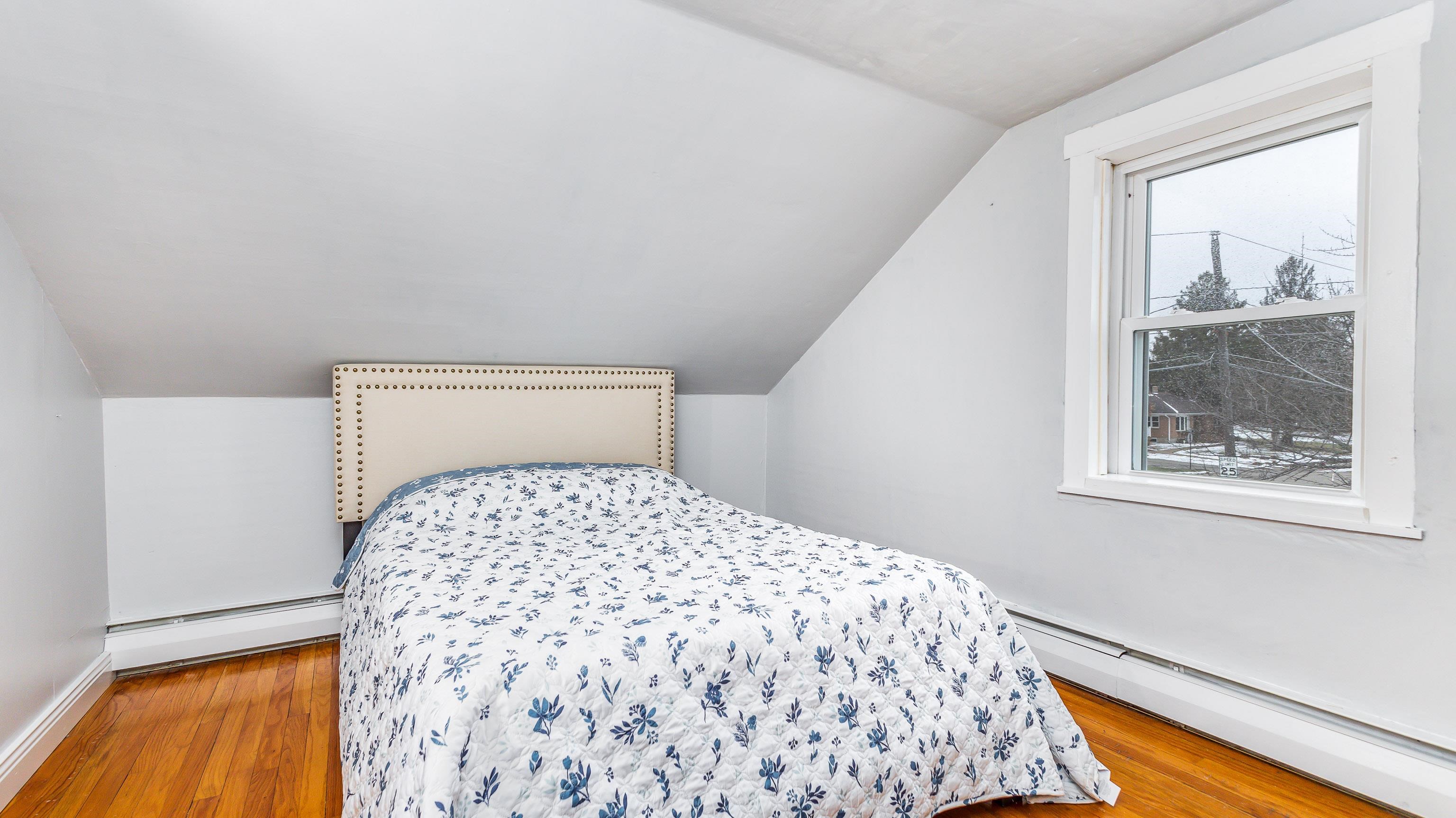 803 Ridge Street Galena, IL 61036 - Photo 8 of 40 a bedroom with a bed and a window