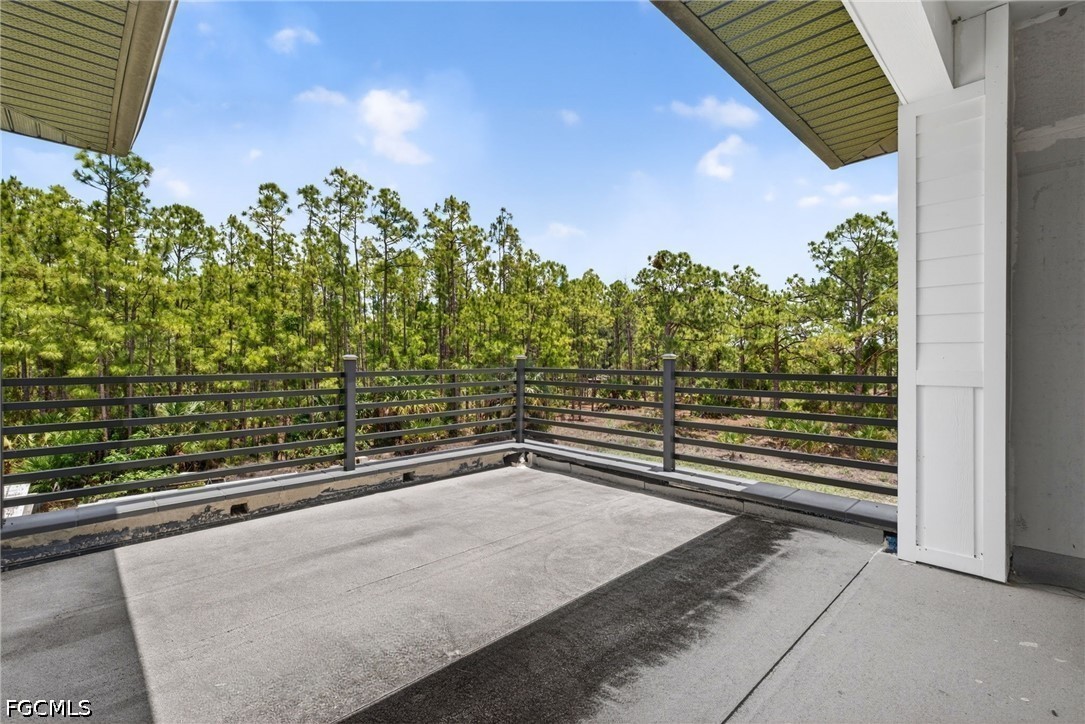 2665 Oil Well Road Naples, FL 34120 - Photo 21 of 40 a view of a balcony with an outdoor space