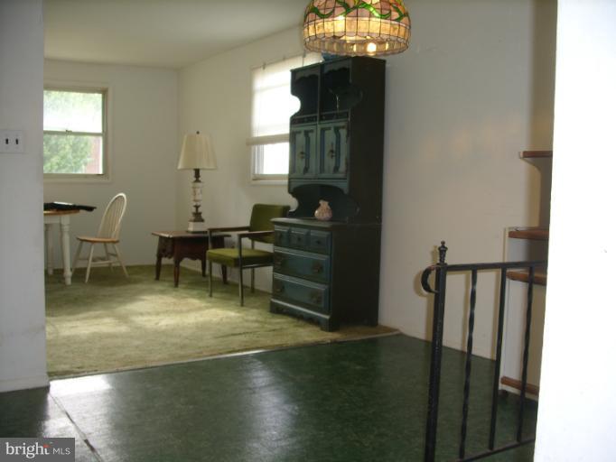 3139 Jeffland Road Windsor Mill, MD 21244 - Photo 1 of 11 a view of a dining room with furniture window and wooden floor