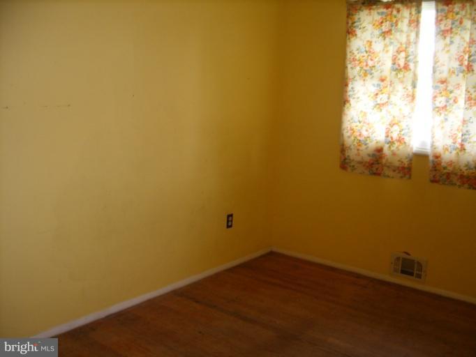 3139 Jeffland Road Windsor Mill, MD 21244 - Photo 4 of 11 a view of a small space with wooden floor and a window