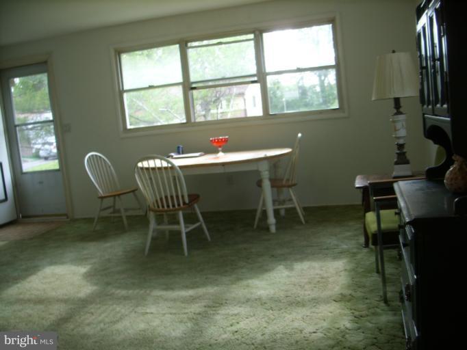 3139 Jeffland Road Windsor Mill, MD 21244 - Photo 8 of 11 a view of a workspace with furniture and a window