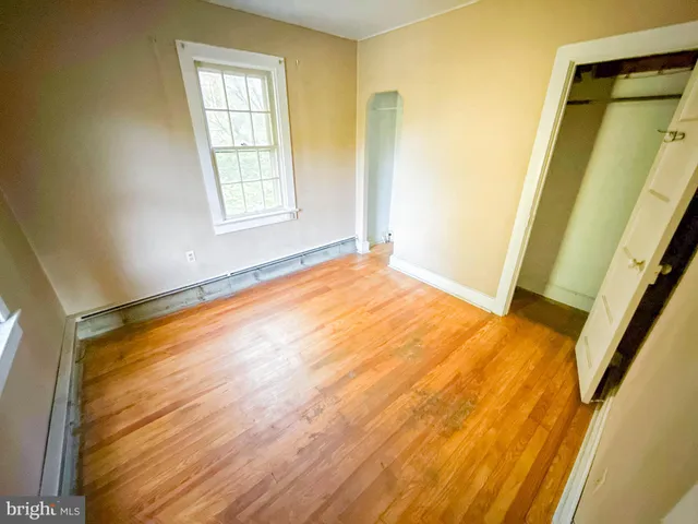 a view of an empty room with windows