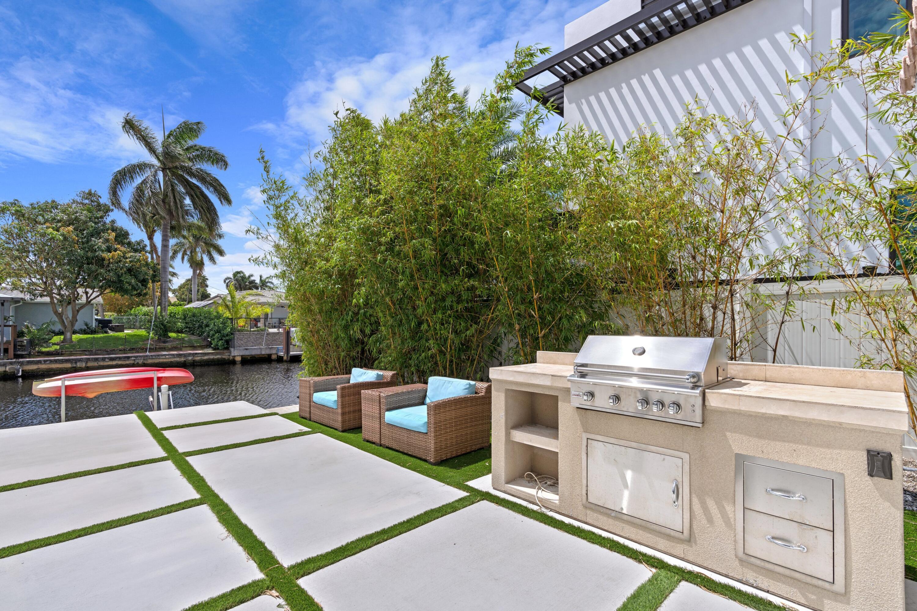 398 Southwest 13th Place Boca Raton, FL 33432 - Photo 18 of 36 a outdoor space with a patio