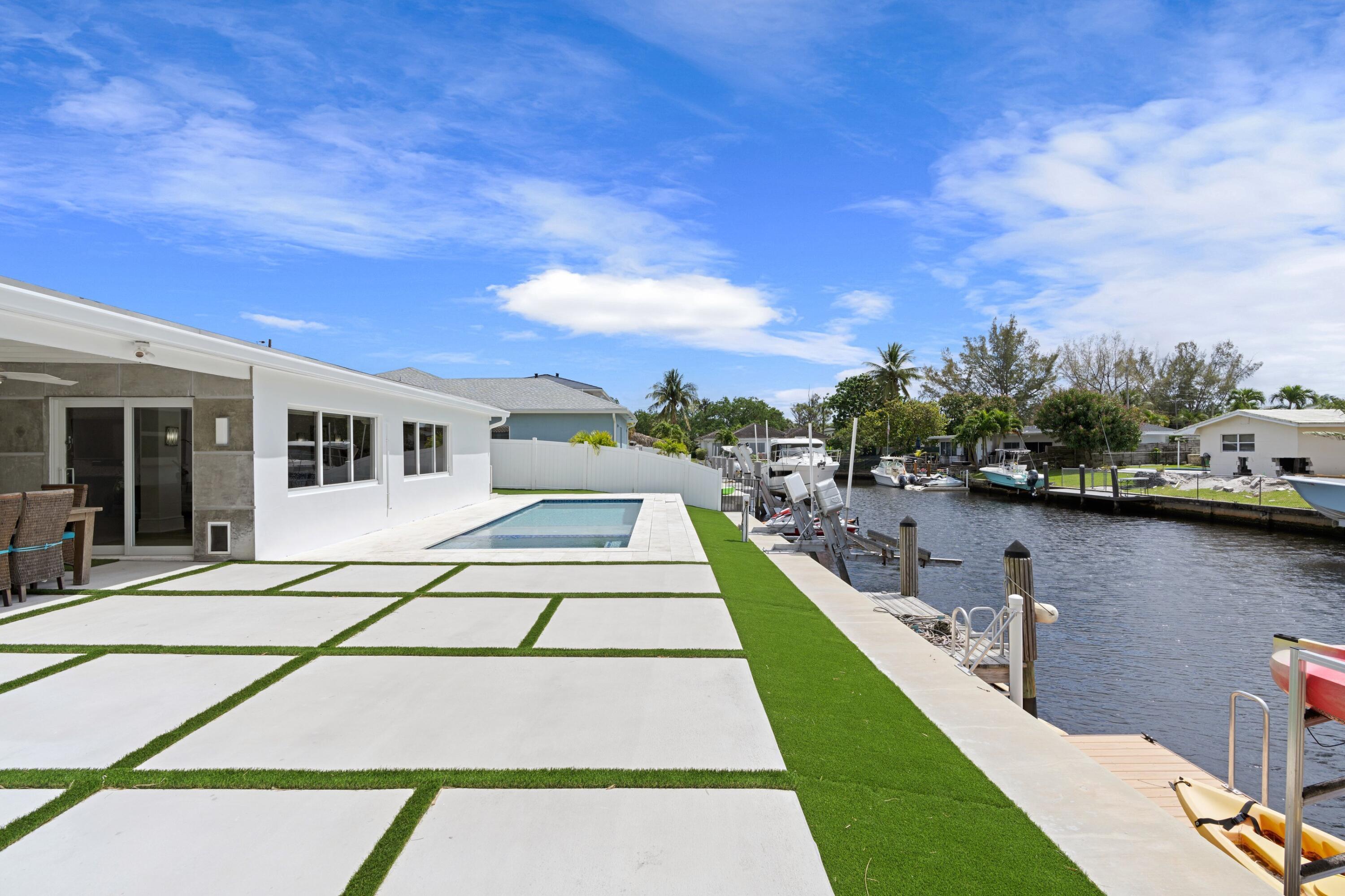 398 Southwest 13th Place Boca Raton, FL 33432 - Photo 20 of 36 a picture of houses with outdoor space