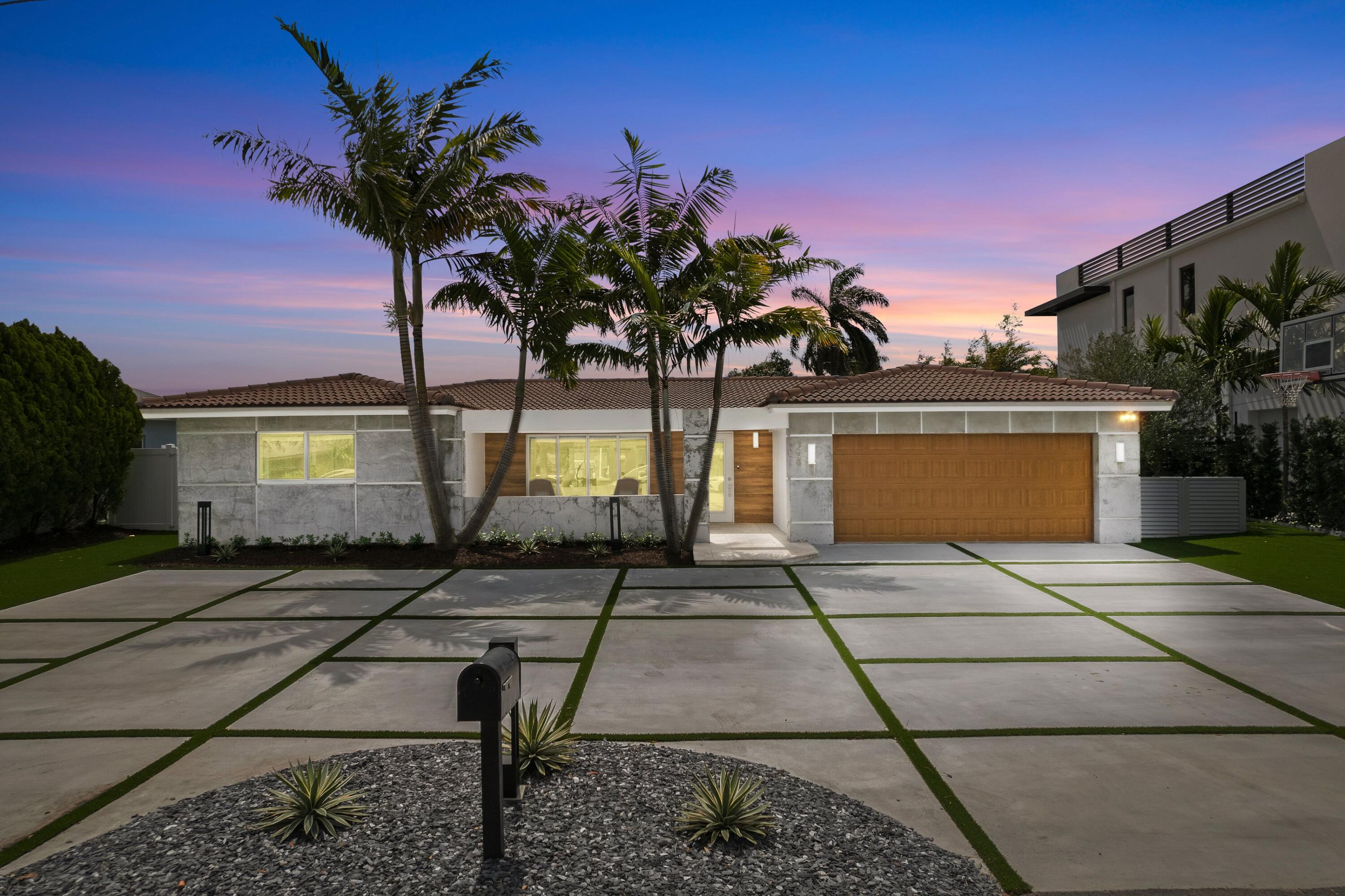 398 Southwest 13th Place Boca Raton, FL 33432 - Photo 23 of 36 a front view of a house with garden