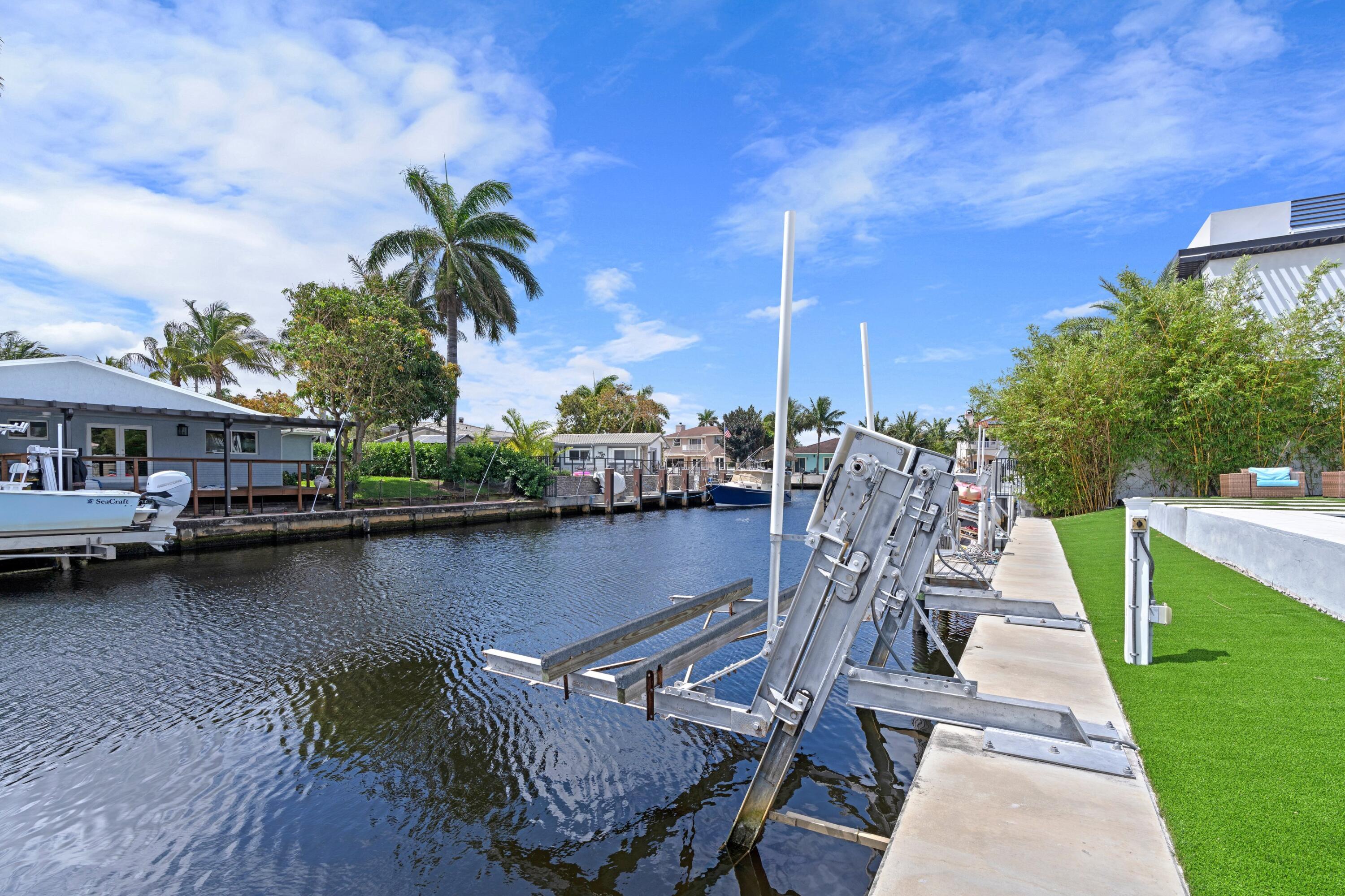 398 Southwest 13th Place Boca Raton, FL 33432 - Photo 3 of 36 a view of outdoor space yard and lake