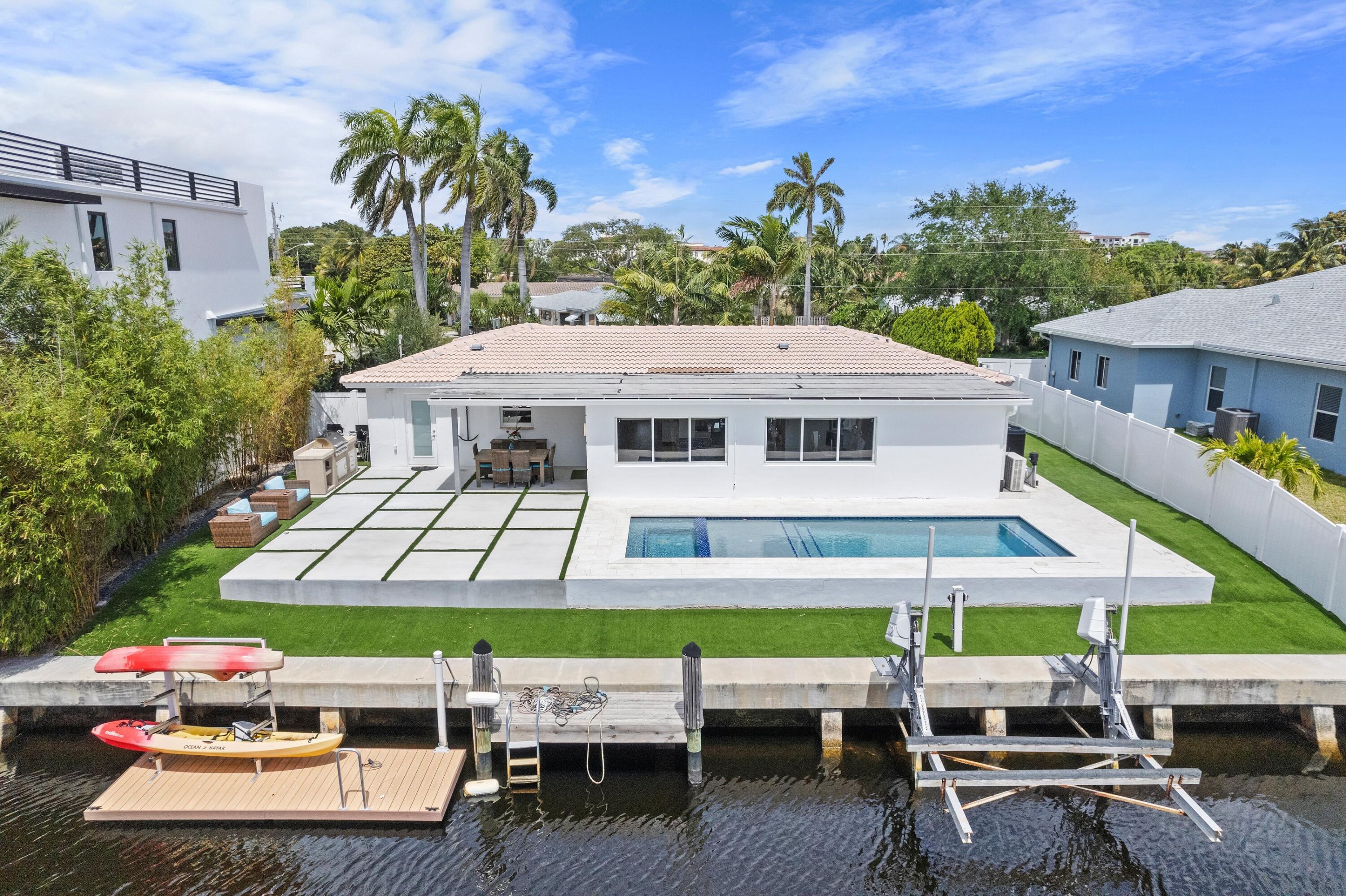 398 Southwest 13th Place Boca Raton, FL 33432 - Photo 4 of 36 an aerial view of a house with a garden and sitting area