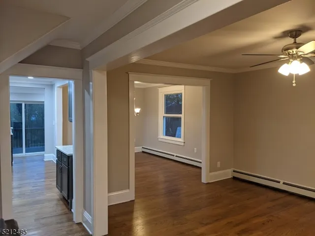 wooden floor in a hall with a window