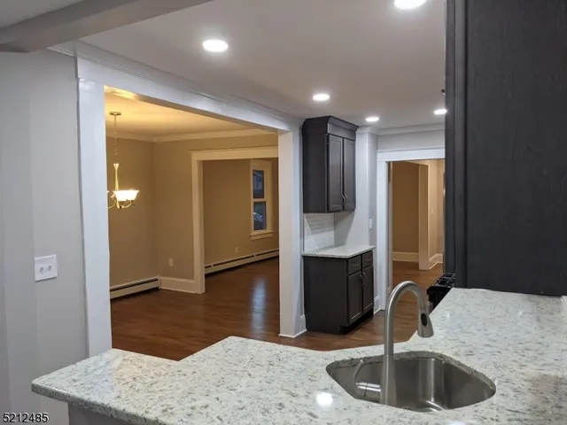 a kitchen with sink and refrigerator