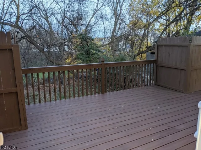 a balcony with wooden floor
