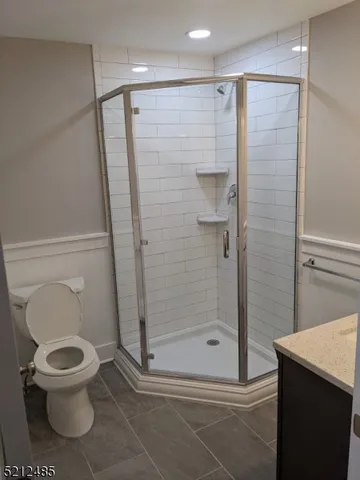a bathroom with a shower and a toilet