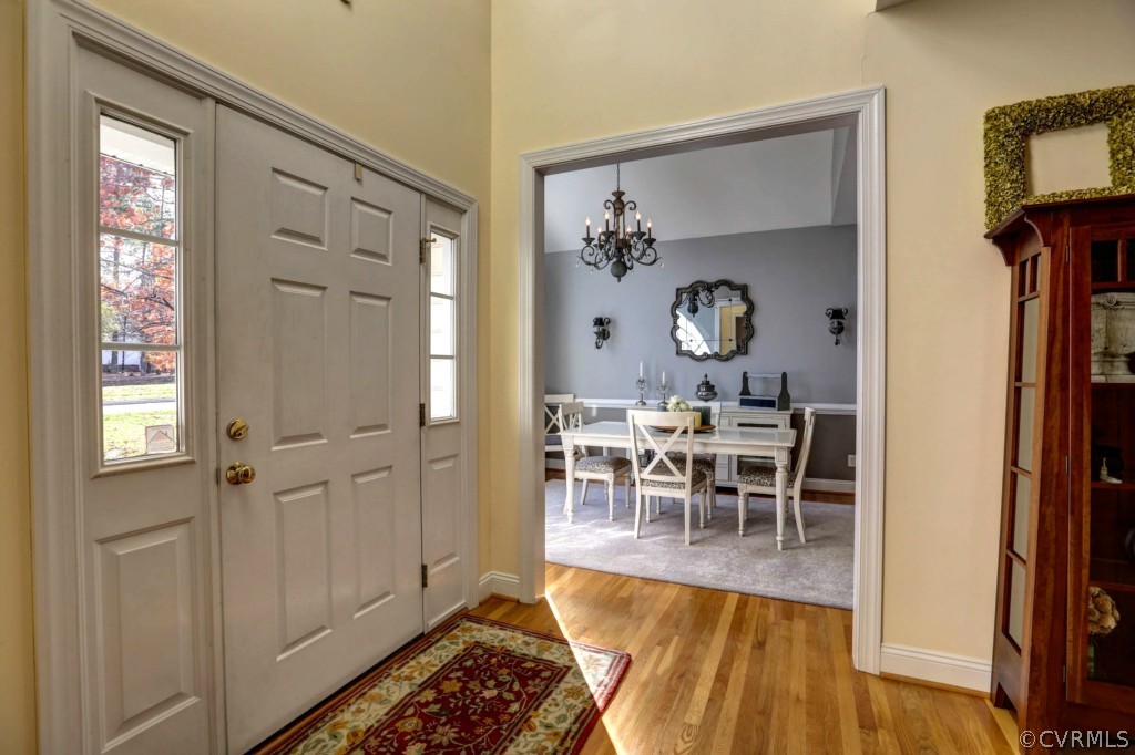 12000 Club Ridge Drive Chester, VA 23836 - Photo 3 of 24 a view of a dining room with furniture and chandelier