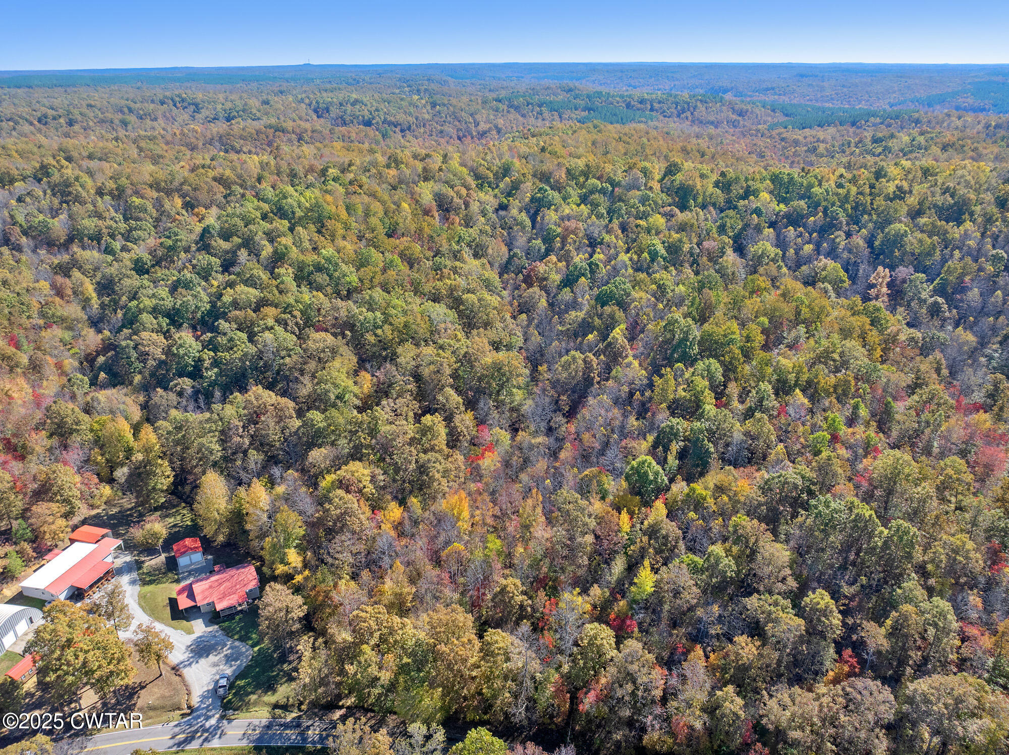 0 Lower Crooked Creek Road Lobelville, TN 37097 - Photo 7 of 15 an aerial view of a houses with a lush green hillside