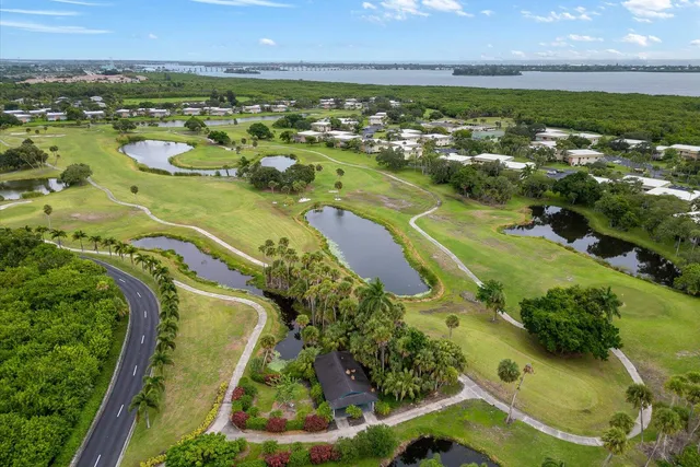 an aerial view of a residential houses with outdoor space