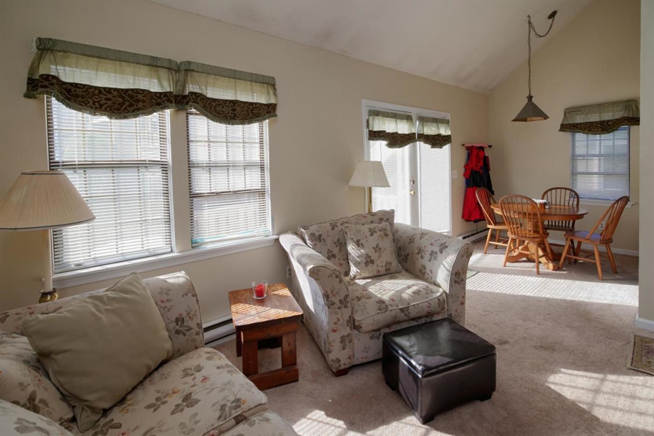 817 Old Strawberry Hill Road, Unit 3B Centerville, MA 02632 - Photo 3 of 9 a living room with furniture and a window