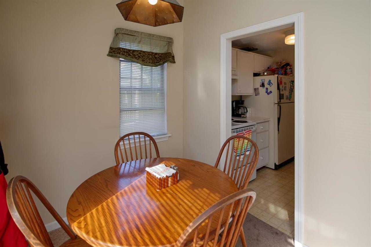 817 Old Strawberry Hill Road, Unit 3B Centerville, MA 02632 - Photo 4 of 9 a view of a dining room with furniture and wooden floor