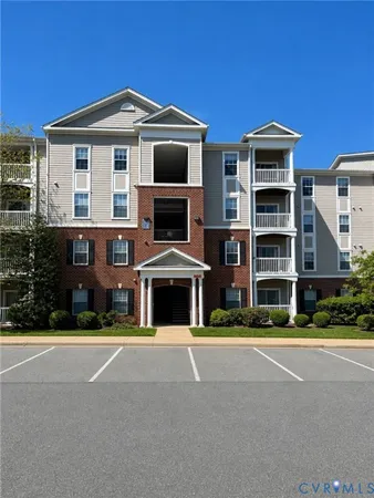 a front view of a building with a yard