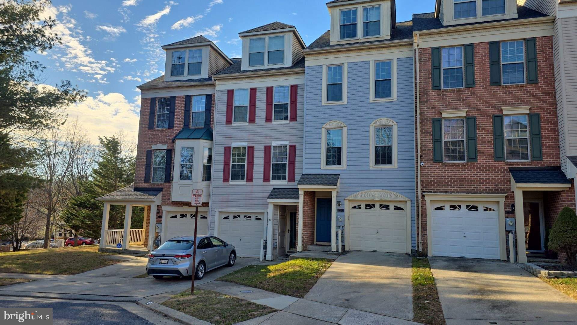 a view of a brick building next to a yard