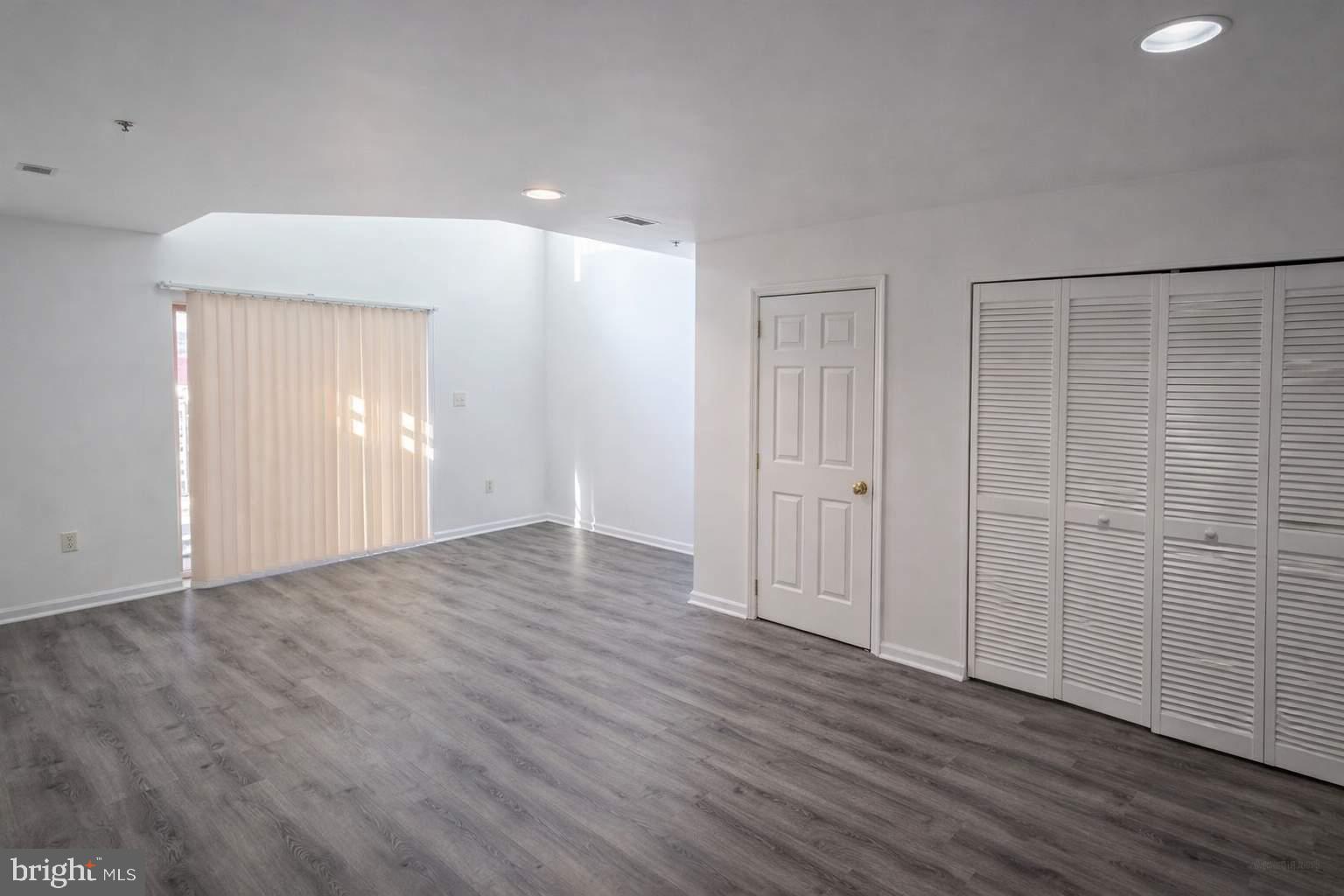 43 Bank Spring Court Owings Mills, MD 21117 - Photo 12 of 20 a view of an empty room with wooden floor