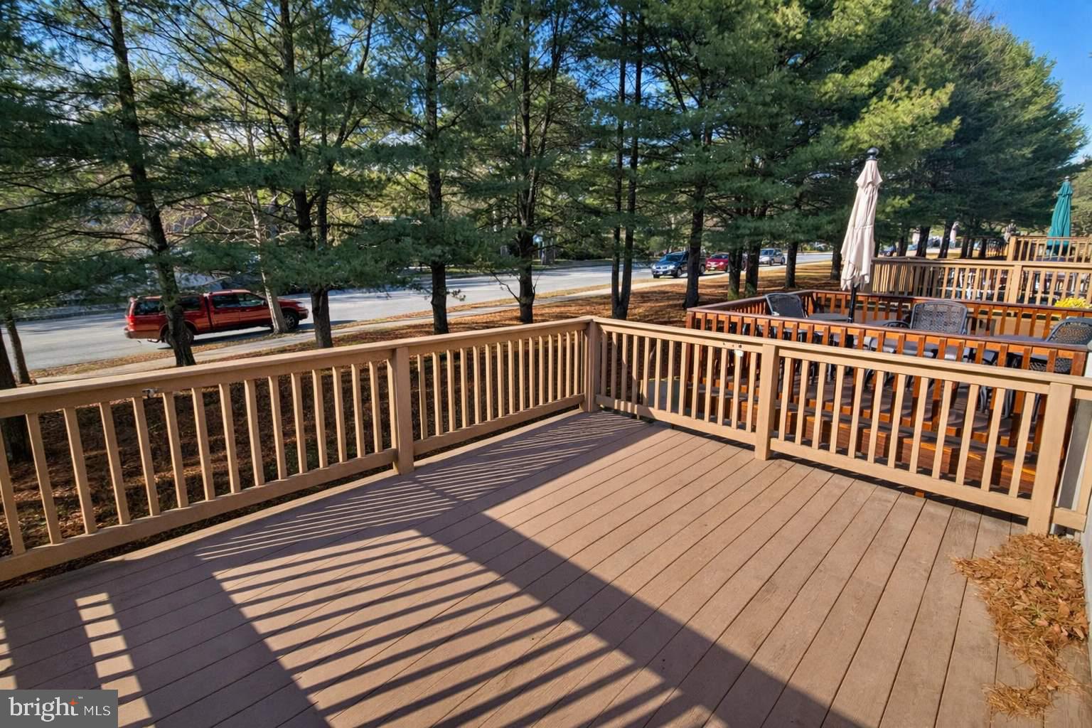 43 Bank Spring Court Owings Mills, MD 21117 - Photo 16 of 20 a balcony with wooden floor and fence