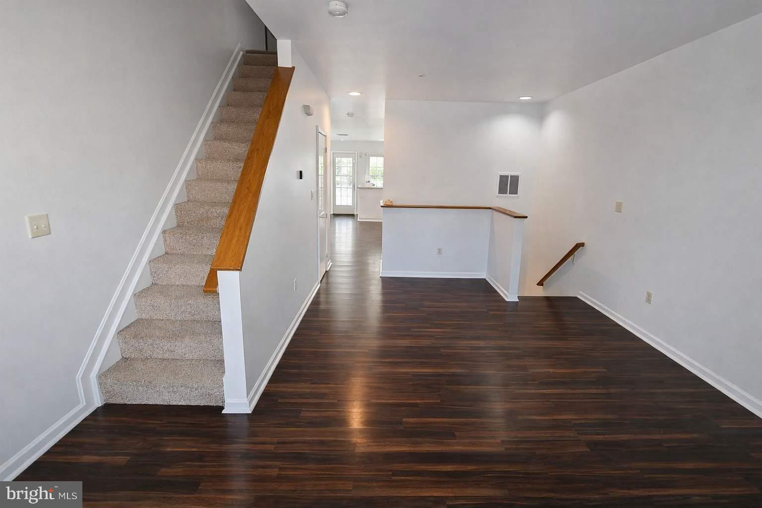 43 Bank Spring Court Owings Mills, MD 21117 - Photo 17 of 20 a view of entryway and hall with wooden floor