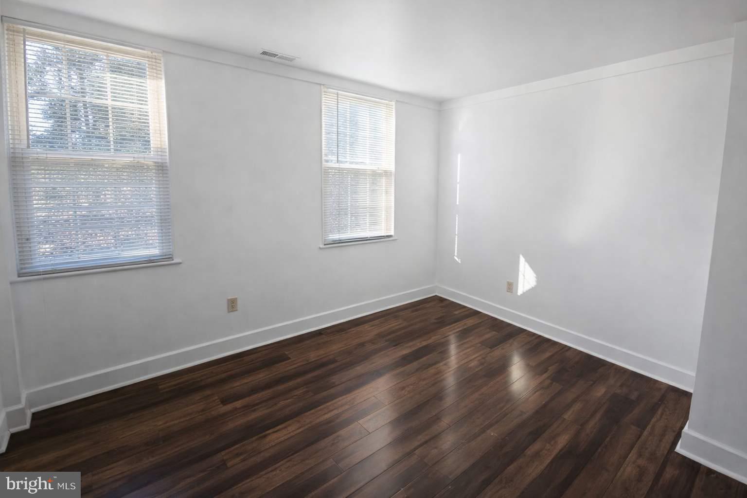 43 Bank Spring Court Owings Mills, MD 21117 - Photo 20 of 20 a view of an empty room with wooden floor and a window