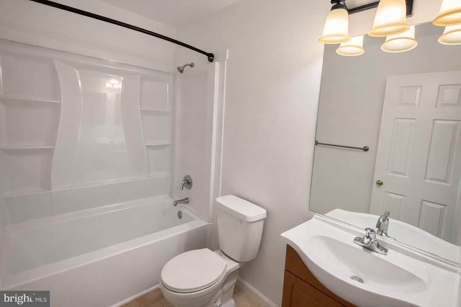 43 Bank Spring Court Owings Mills, MD 21117 - Photo 2 of 20 a bathroom with a sink toilet and shower