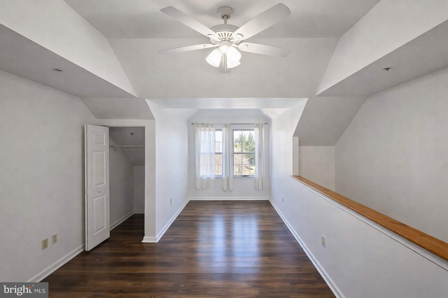43 Bank Spring Court Owings Mills, MD 21117 - Photo 8 of 20 wooden floor in an empty room with a window