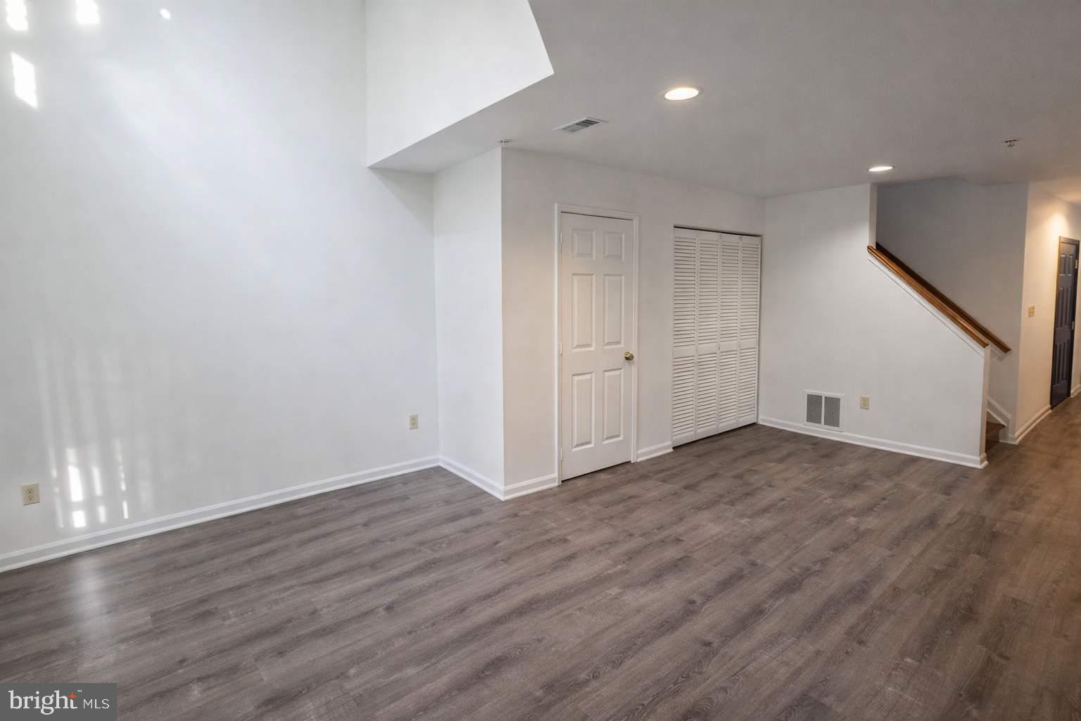 43 Bank Spring Court Owings Mills, MD 21117 - Photo 10 of 20 a view of an empty room with wooden floor