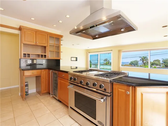 a kitchen with a stove and a sink