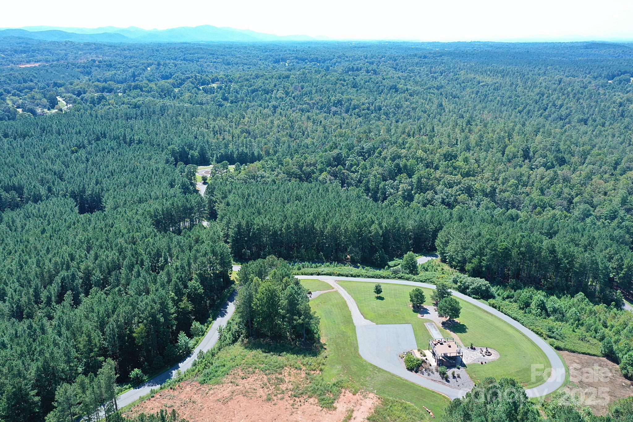 335 Table Rock Trace Northwest, Unit 154 Valdese, NC 28690 - Photo 17 of 25 a view of a swimming pool with a yard