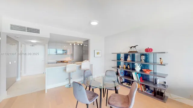 a living room with lots of furniture and clutter