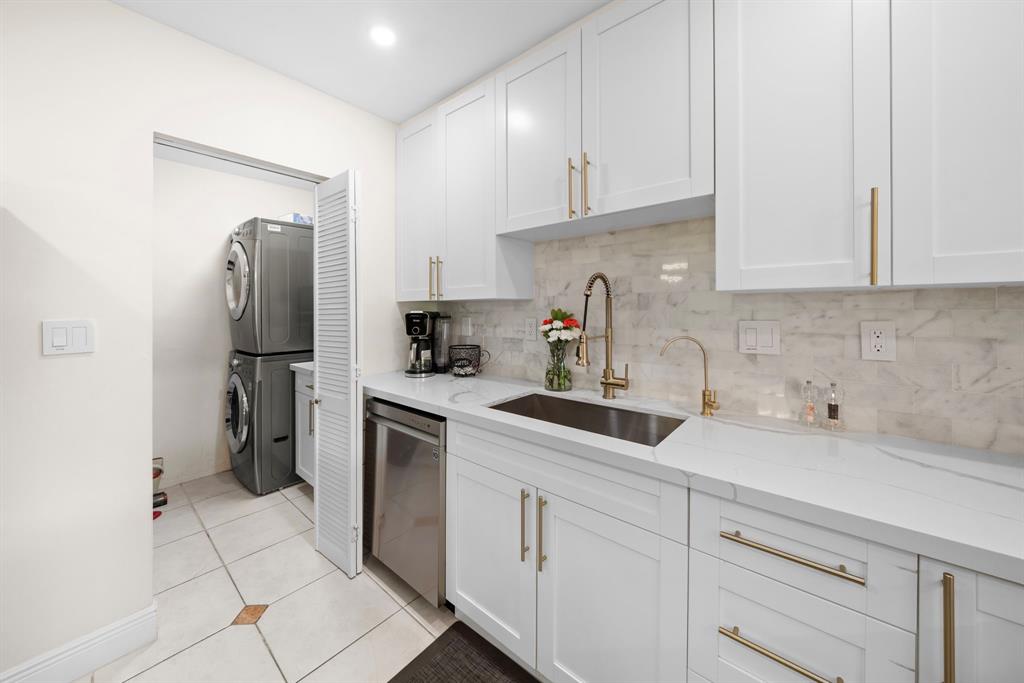 4804-4806 Northeast 21st Avenue Fort Lauderdale, FL 33308 - Photo 11 of 31 a kitchen with a refrigerator sink and cabinets