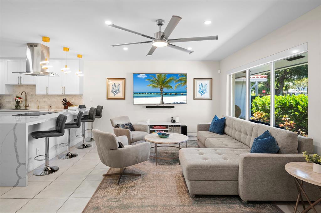 4804-4806 Northeast 21st Avenue Fort Lauderdale, FL 33308 - Photo 2 of 31 a living room with furniture and a large window