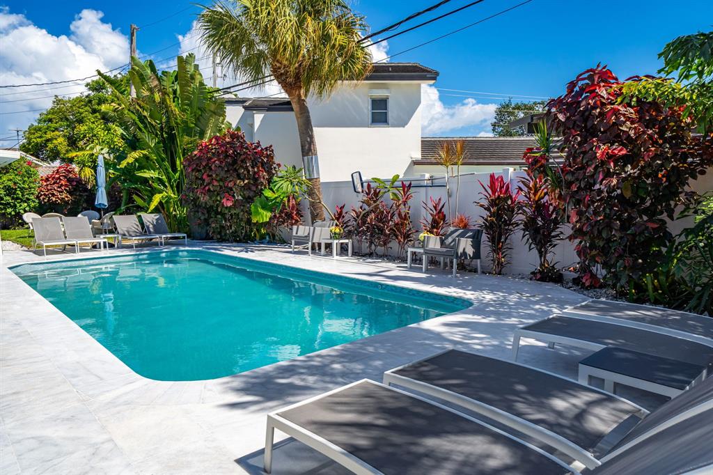 4804-4806 Northeast 21st Avenue Fort Lauderdale, FL 33308 - Photo 26 of 31 a view of a swimming pool with a patio