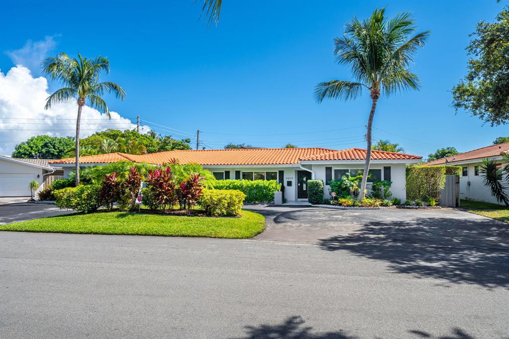 4804-4806 Northeast 21st Avenue Fort Lauderdale, FL 33308 - Photo 29 of 31 a front view of a house with garden