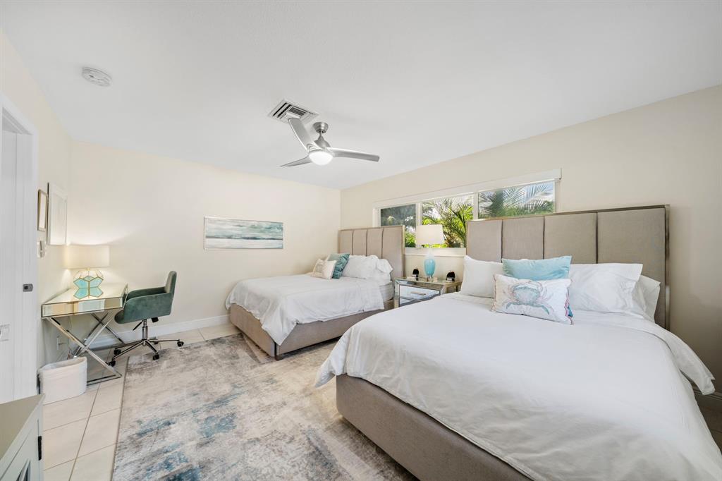 4804-4806 Northeast 21st Avenue Fort Lauderdale, FL 33308 - Photo 6 of 31 a bedroom with two beds and painting on the wall