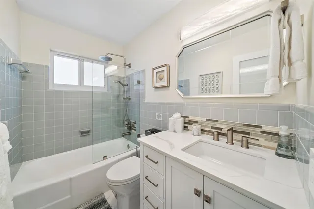 a bathroom with a sink a toilet and a bathtub