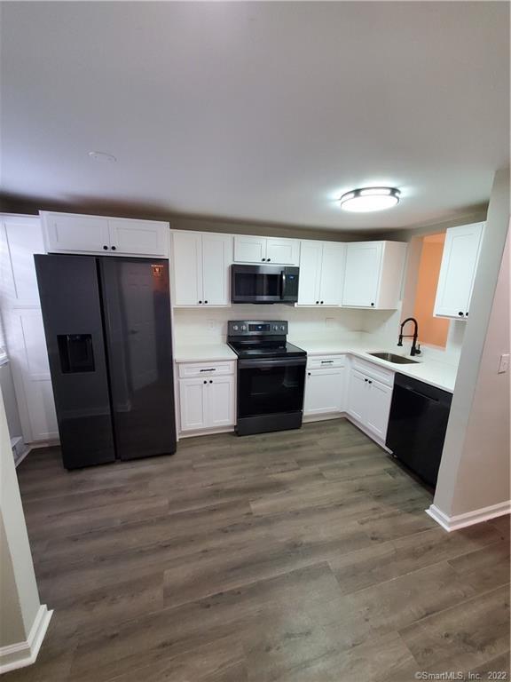 116 Rising Trail Drive, Unit 116 Middletown, CT 06457 - Photo 1 of 1 a kitchen with stainless steel appliances granite countertop a refrigerator and a sink