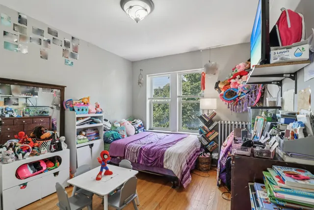 a bedroom with furniture a bed and a window