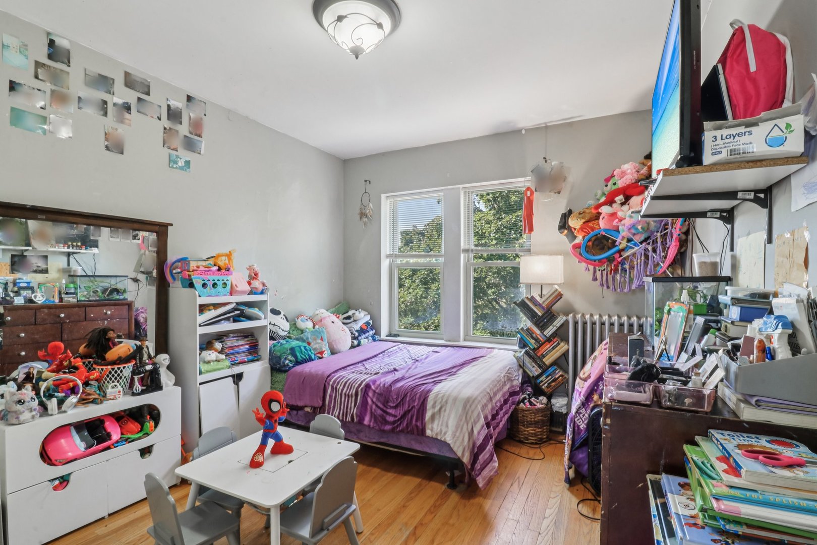 5621 North Spaulding Avenue, Unit 3S Chicago, IL 60659 - Photo 15 of 28 a bedroom with furniture a bed and a window