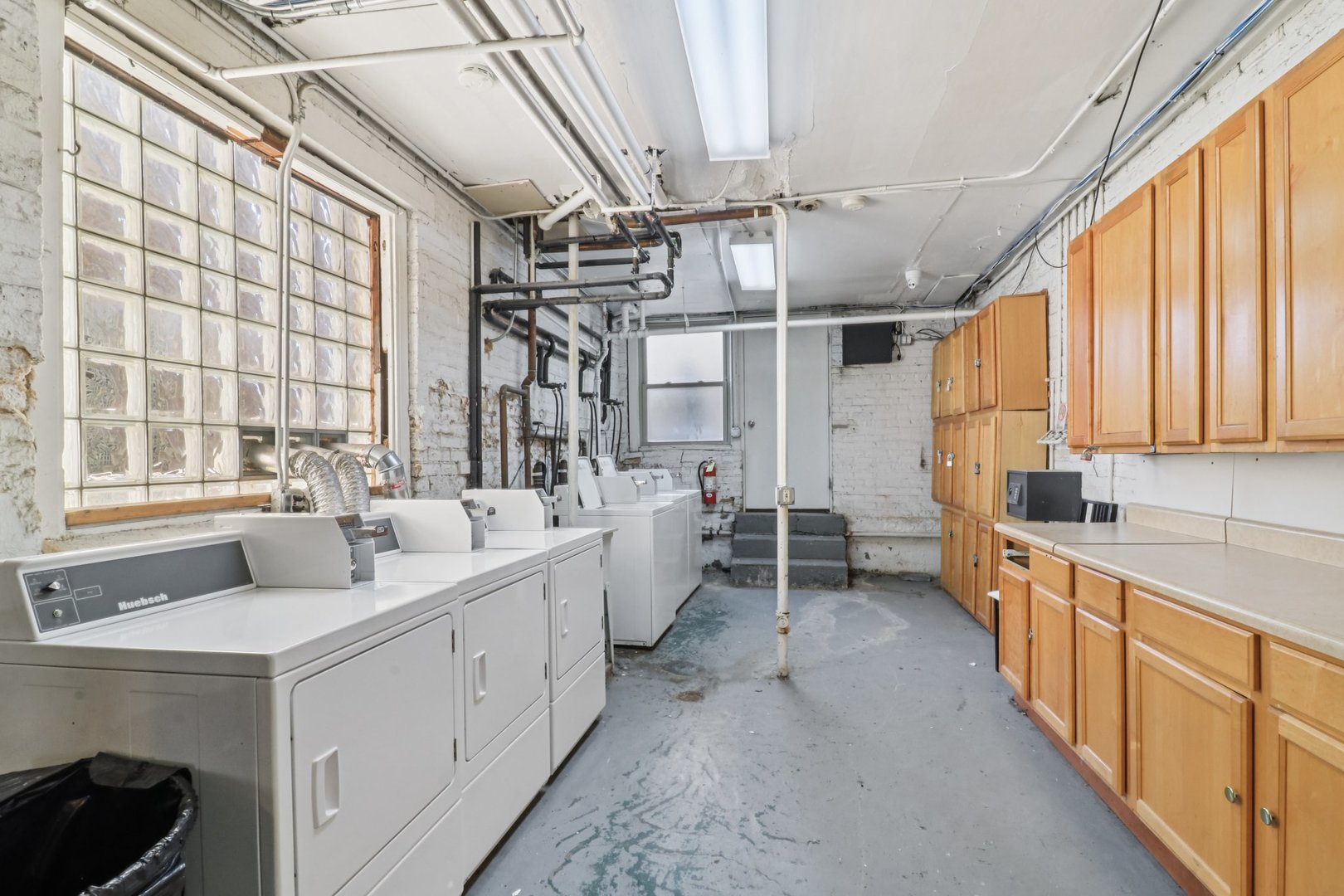 5621 North Spaulding Avenue, Unit 3S Chicago, IL 60659 - Photo 21 of 28 a large white kitchen with a large window