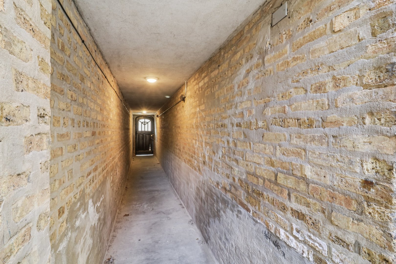 5621 North Spaulding Avenue, Unit 3S Chicago, IL 60659 - Photo 26 of 28 a hallway with sliding door and wooden floor