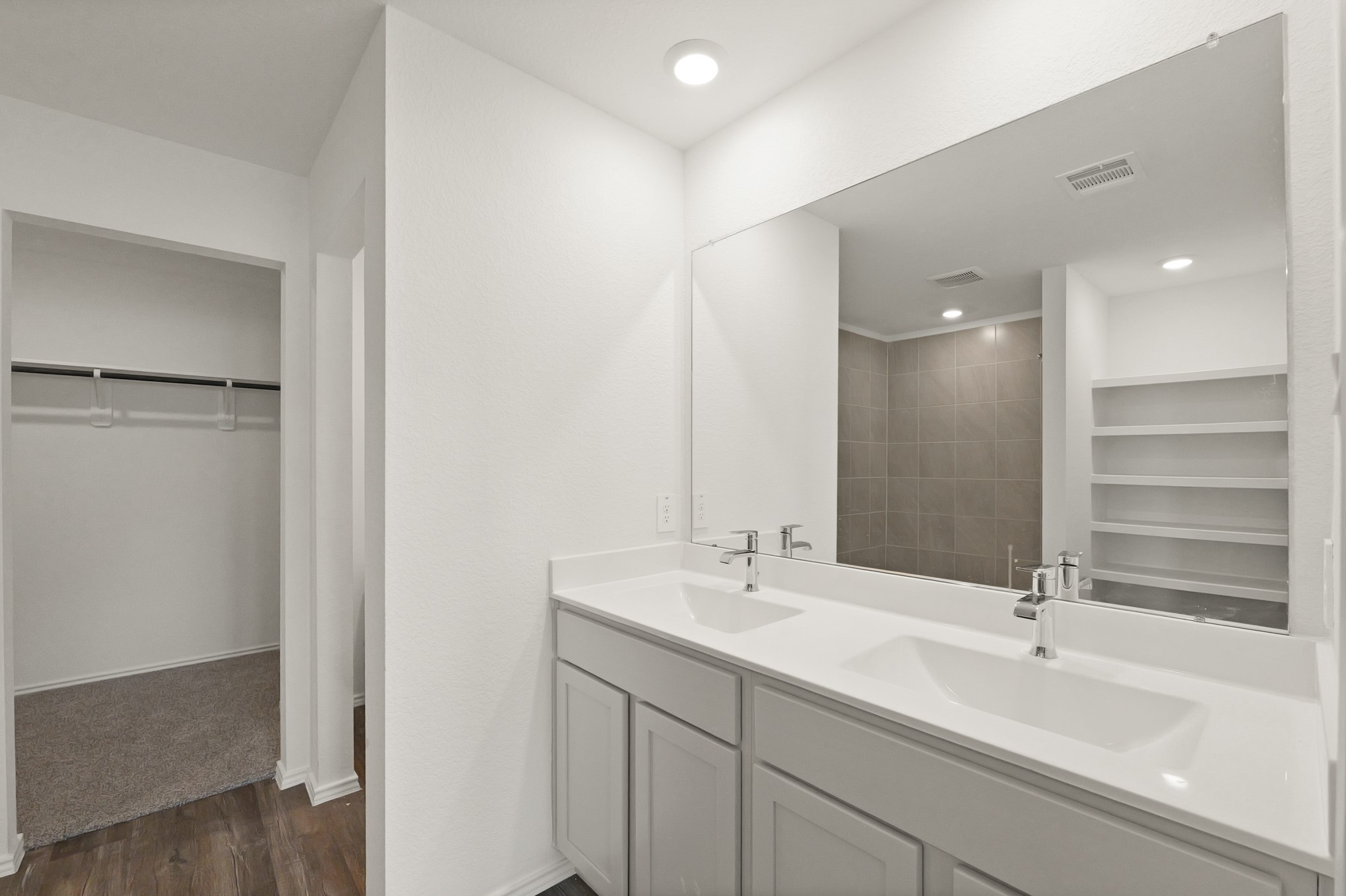 14392 Oceanblue Way Splendora, TX 77372 - Photo 15 of 30 a bathroom with a sink and a large mirror