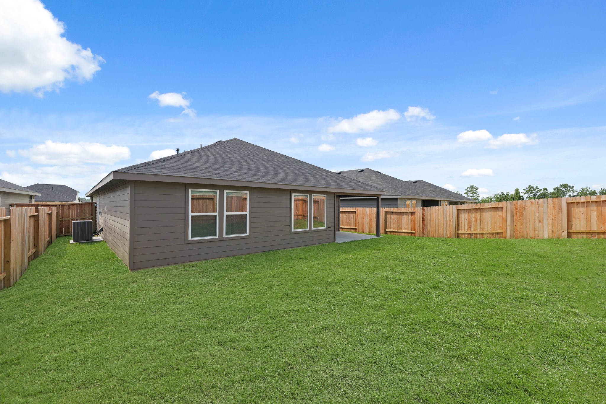 14392 Oceanblue Way Splendora, TX 77372 - Photo 22 of 30 a view of a yard in front of a house with large trees
